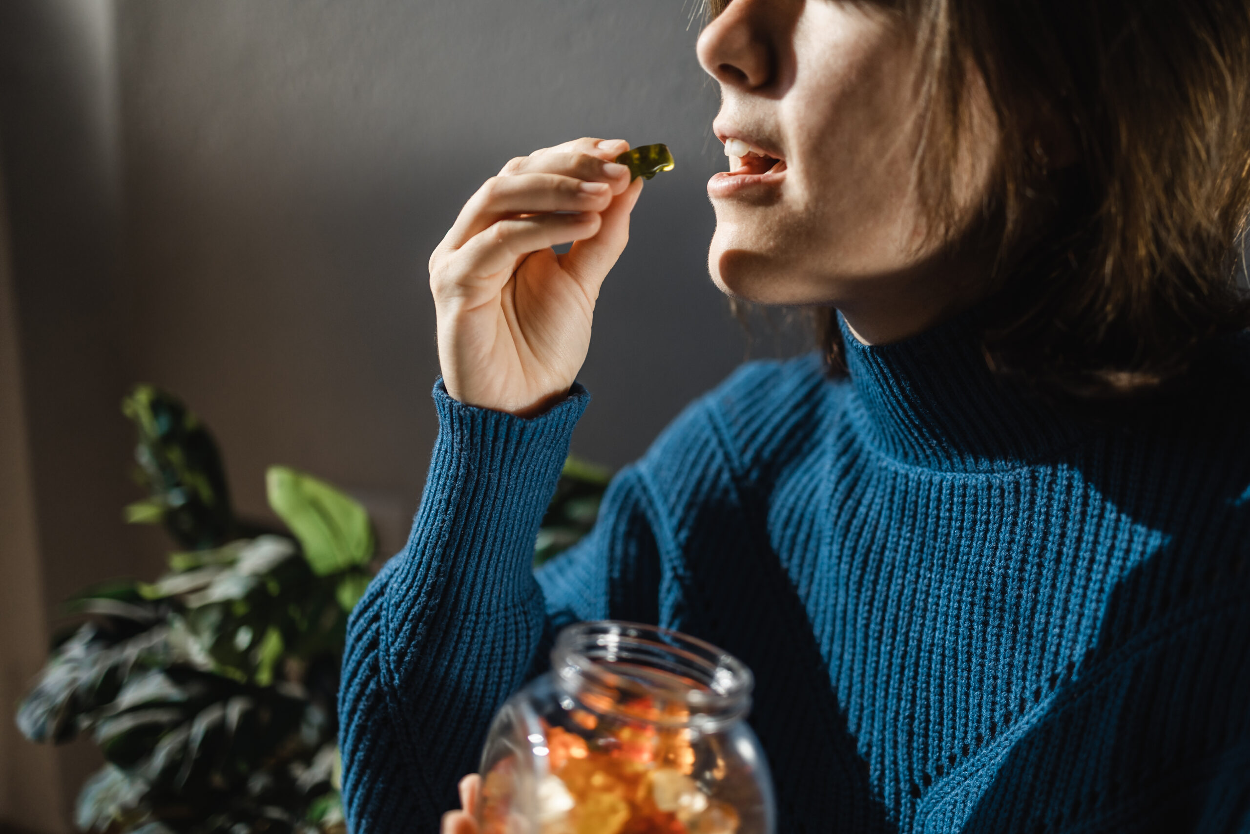 cbd cannabis gummy woman eating edible weed swee 2022 01 30 07 15 05 utc scaled